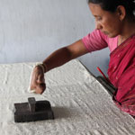 

   Impacting the block on the fabric   
.
