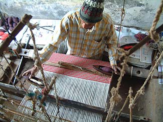 

   Weaver at his loom   

