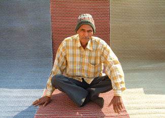 

   Weaver with his products   

